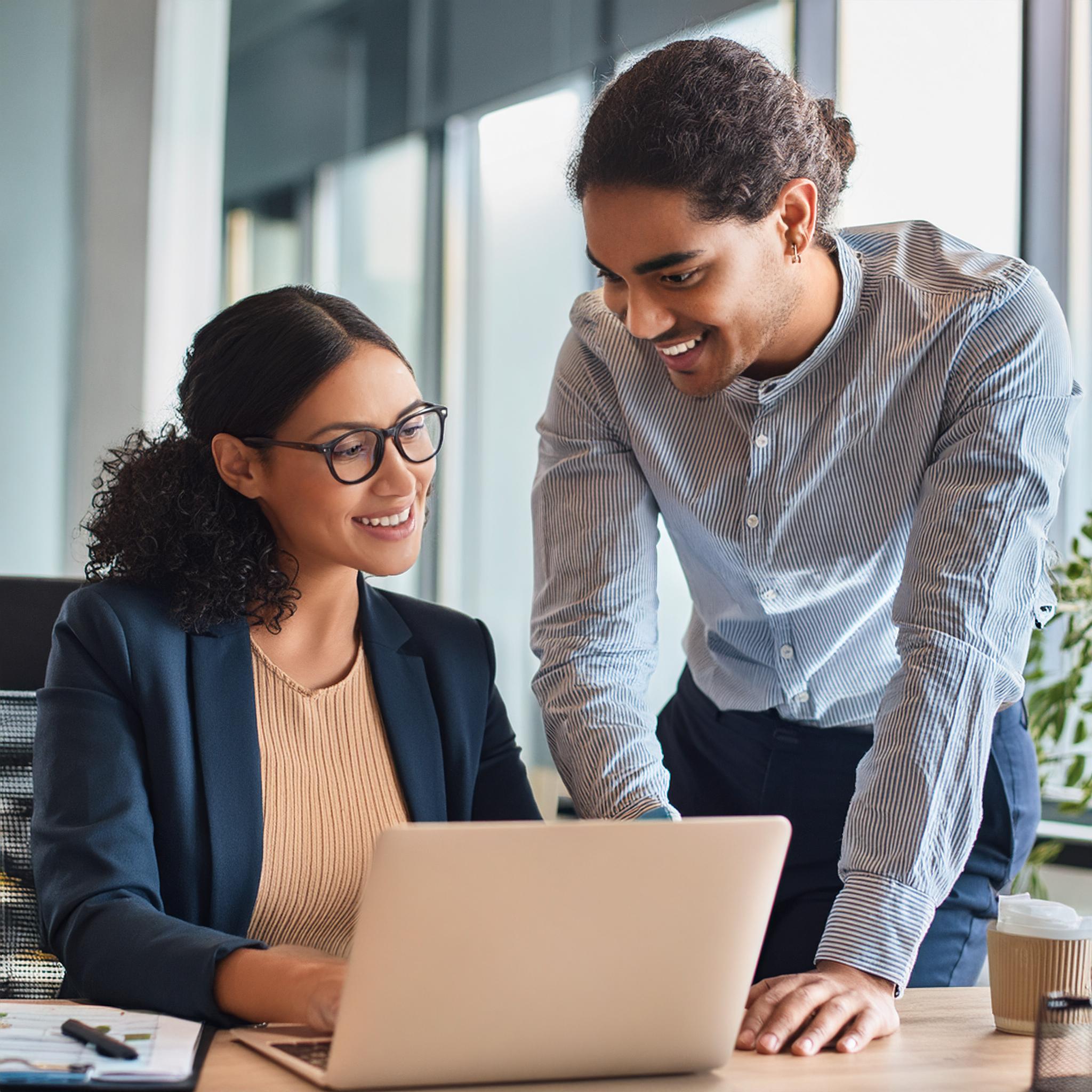 Managed IT Tech helping client at desk